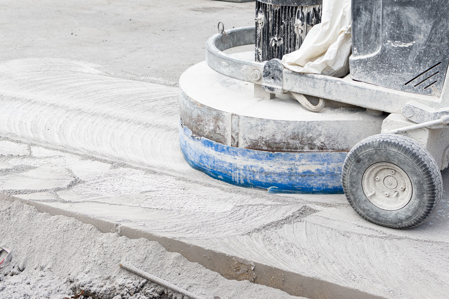 Grinding machine working on Concrete city road on construction site